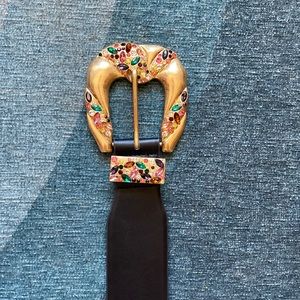 Belt with bejeweled oversized buckle.
